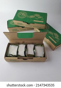 4 Four Pieces Of Traditional Malay Dessert Kuih Tepung Pelita In A Box. Nice Packaging. Brand Adik B'dik. Sell At Ramadhan Bazar And Street Stall. White Background. Malaysia, April 2022