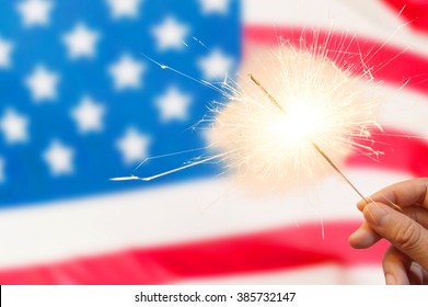 4 Of July Concept With Sparkler And Usa Flag