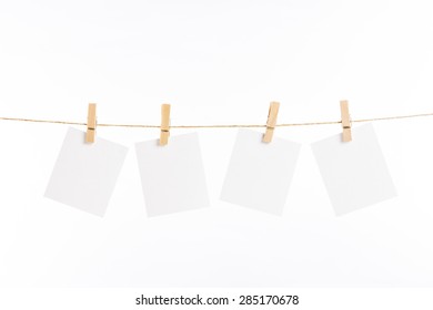 4 Note Paper Cards Hanging With Wooden Clip Or Clothespin On Rope String Peg Isolated On White Background