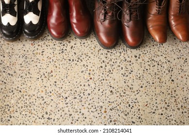 4 Pairs Of Shoes Lined Up At The Entrance.