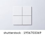 4 pieces of white tile with white background