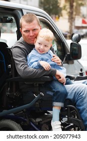 4 Year Old Boy And 35 Year Old Disabled Men On Wheelchair Lift