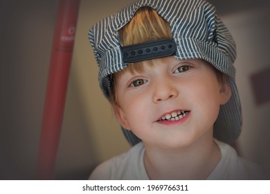 4 Year Old Boy In Train Conductor Hat