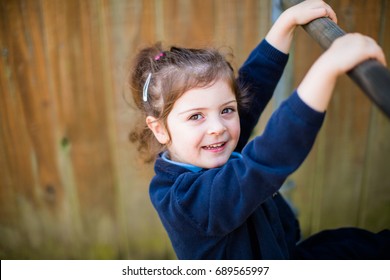 4 Year Old Confident Primary Schoolgirl In School Uniform Looks Forward To Starting School