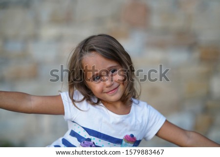 Similar – Image, Stock Photo Adorable little girl combed with pigtails