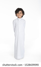 4 years old Arab Saudi boy with different poses expressions and props on a white isolated background, ready for cutout and design purposes.