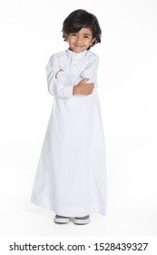 4 years old Arab Saudi boy with different poses expressions and props on a white isolated background, ready for cutout and design purposes.