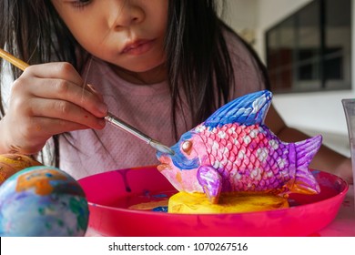 4 Years Old Asian Little Cute Girl  Painting. Painting Is Play Therapy For ADHD Kids (Attention Deficit Hyperactivity Disorder),can Be Used To Address Emotional Problems.