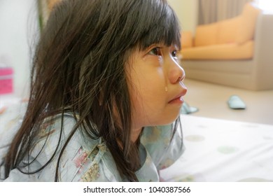 4 Years Old Little Cute Girl With Influenza Hospital Admission, Crying With Tearful On Her Face. Homesick Child, Kid With Attention Deficit Hyperactivity Disorder (ADHD) Can't Handle Her Emotion.