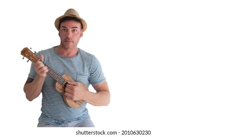 40 45 Year Old Man Playing Ukulele With White Background Wearing Striped T-shirt And Hat.