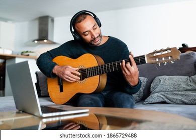 40 Years Old Man Learning The Guitar With Online Lessons At Home