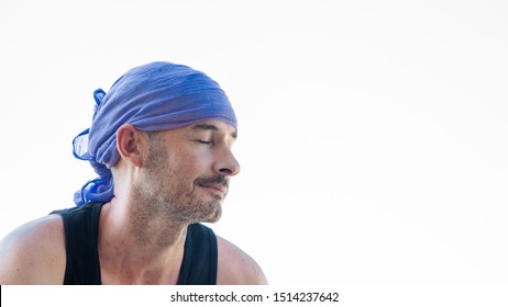 40 Years Old Man Suffering Fron Cáncer With Blue Head Scarf