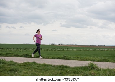 40 Years Old Woman Jogging (running) Outside