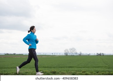 40 Years Old Woman Jogging (running) Outside