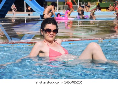 40 Years Old Woman In The Pool. Happy Woman Enjoy In The Swimming Pool