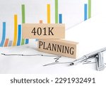 401 K PLANNING text on wooden block on chart background , business concept