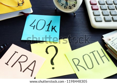 401k ira roth on pieces of paper. Retirement planning.