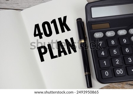 401K Plan text message written on note page with calculator top view on wooden background