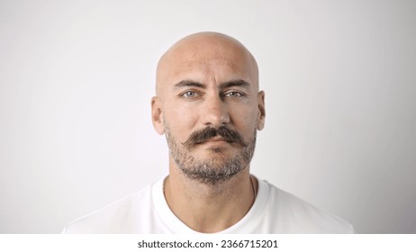 40s bald man cute moustache. One stylish mustache portrait close up. No hair guy look camera. 30 brutal serious sad face. Old fashion head shot. Barber shop beard style. Nice t shirt. White background