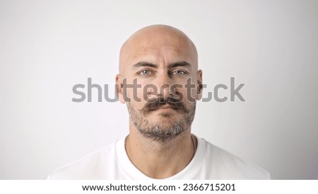 40s bald man cute moustache. One stylish mustache portrait close up. No hair guy look camera. 30 brutal serious sad face. Old fashion head shot. Barber shop beard style. Nice t shirt. White background