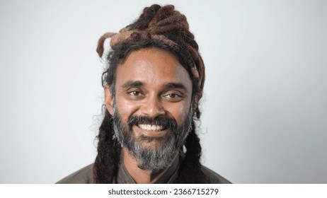 40s indian man with dreadlocks hair style. Gray beard asian face close up. Happy hindu guy look camera. Dreads hairstyle portrait. One 30 years old arab head shot. Young adult male person smile Asia. - Powered by Shutterstock