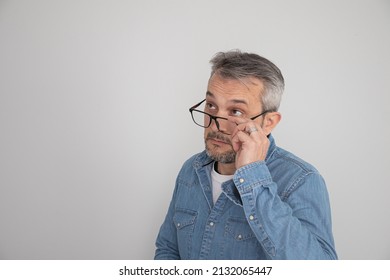 40's Man With Black Glasses With Presbyopia 