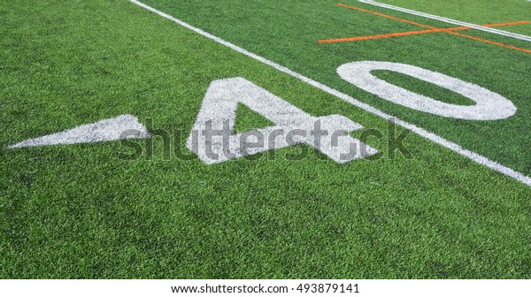 The 40-yard-line of an american football field with
artificial turf