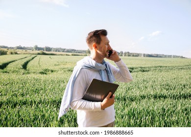 40-year-old Young Farmer Checks His Crop And Negotiates Deal On Smart Phone