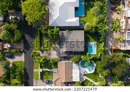 429 NE 8th Ave, Fort Lauderdale
Aerial drone views and overhead image of property in a residential area of Miami, front and back with pool, natural and synthetic grass, bushes, palm trees, garage