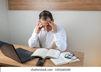 43 Year Old Man Studying And Worried To Make His Report.