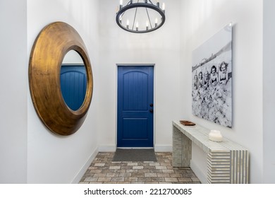 444 NE 93rd St, Miami Shores, FL, Miami, USA
April 14, 2022

Interior View Of Home Entrance, With Blue Door With Carpet, Gold-framed Mirror, Chandelier, Billboard, Cobblestone Floor, White Walls 