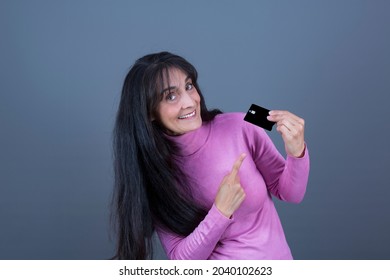 45 Year Old Successful And Empowered Woman, Long Haired Brunette Showing Credit Card.