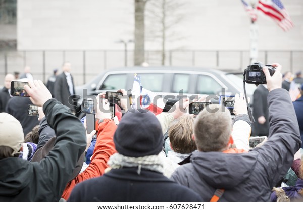45th Presidential\
Inauguration, Donald Trump: People take pictures with cellphones of\
the Presidential Motorcade on Pennsylvania Ave, NW, WASHINGTON DC -\
JAN 20 2017