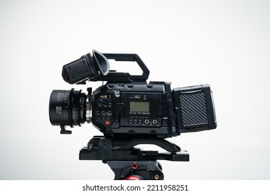4.6k Digital Cinema Camera On A Tripod With A 50mm F1.4 Prime Cine Lens Viewfinder Top Handle Compact White Background