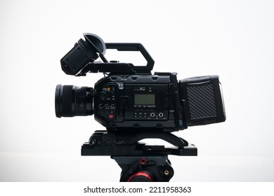 4.6k Digital Cinema Camera On A Tripod With A 50mm F1.4 Prime Lens Viewfinder Top Handle Compact White Background
