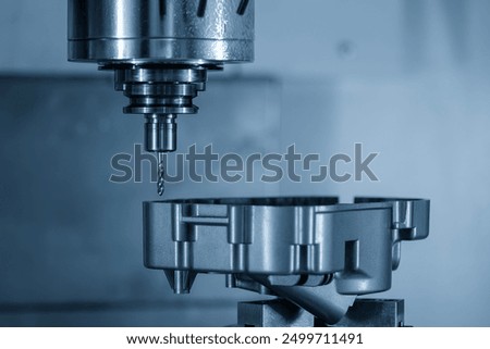 The 4-axis CNC milling machine tapping the motorcycle gear case parts by tapping tool. The high precision automotive parts manufacturing process by multi-axis machining center.