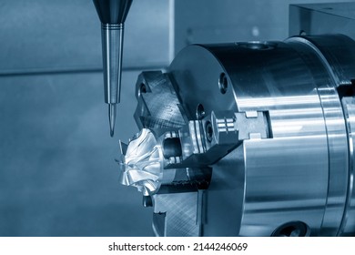 The  4-axis  machining center cutting the turbocharger parts with solid ball end mill tool. The hi-precision automotive manufacturing process by multi-axis CNC milling machine.