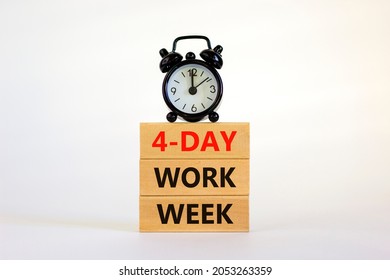 4-day work week symbol. Concept words '4-day work week' on wooden blocks. Black alarm clock. Beautiful white background. Copy space. Business and 4-day work week concept. - Shutterstock ID 2053263359