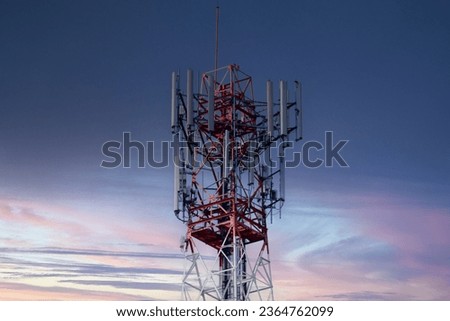 4G and 5G cellular. Macro Base Station or Base Transceiver Station. Telecommunication tower.  Development of communication systems in urban area against twilight sunset background.