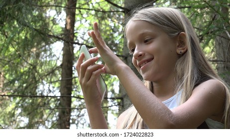 4K Child Playing Smartphone, Little Girl Using Mobile in Mountains Trails Forest