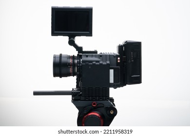 4k Digital Cinema Camera On A Tripod With A Compact Cine Lens White Background