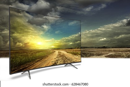 4k Monitor Isolated On White.  The Road Is Rural, Unpaved In The Steppes At Sunset. Concept