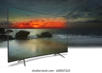 4k Monitor Isolated On White. TV To The Ocean. Sunset. Above The Sea. Conceptual Idea