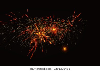 4K New Year's Night and Diwali HD Colourful Starbursts and Rocket Explosions on a Black Background Sky with Red, Green, Blue, Purple, and Gold Colour Fireworks Bursts with Space for Text—Smoke-Free