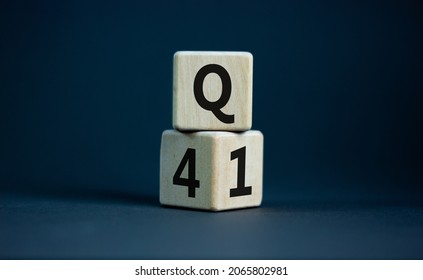 From 4th To 1st Quarter Symbol. Turned Wooden Cubes And Changed Words 'Q4' To 'Q1'. Beautiful Grey Table, Grey Background. Business, Happy 1st Quarter Q1 Concept, Copy Space.