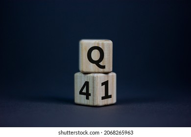 From 4th To 1st Quarter Symbol. Turned Wooden Cubes And Changed Words 'Q4' To 'Q1'. Beautiful Grey Table, Grey Background. Business, Happy 1st Quarter Q1 Concept, Copy Space.