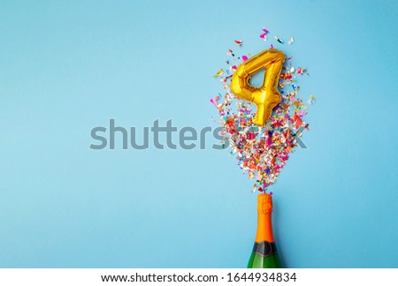 4th anniversary champagne bottle balloon pop