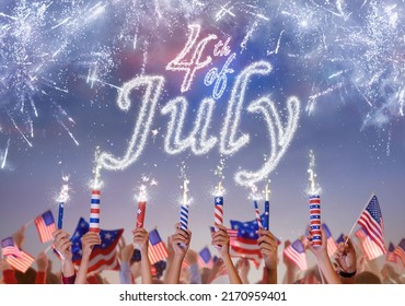 4th of July in America. USA Independence day fireworks. Hands holding firecrackers, sparkler and American flag celebrating US patriotic holiday. Patriots cheering for freedom.