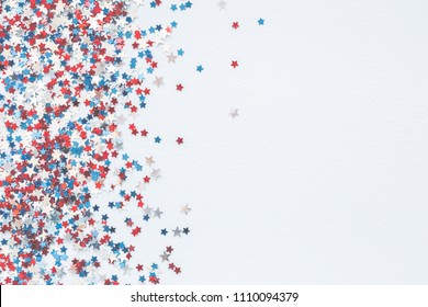 4th of July American Independence Day decorations on pastel blue background. Flat lay, top view, copy space - Shutterstock ID 1110094379