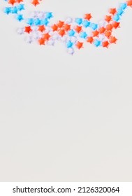 4th of July American Independence Day decorations on white background. flat lay minimalistic compositions, space for text, vertical frame.